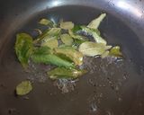 A picture of step 1 of Garlic masala rice.