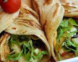 A picture of step 6 of Chicken tikka egg roll paratha.
