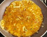 A picture of step 5 of Italian cheese and herbs omelette.