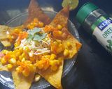 A picture of step 6 of Nachos with corn salsa.