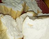 A picture of step 4 of Bread coated with akara paste.