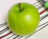A picture of step 1 of Bunny- shaped green apple wedges.