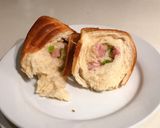 A picture of step 8 of Wool Roll Bread - Spring onion & pancetta filling.