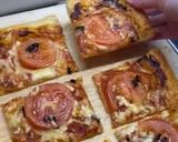 A picture of step 5 of ‘Nduja pastry with Black Garlic drizzle.