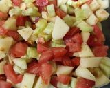 A picture of step 2 of Cucumber Apple and Tomato Salad.
