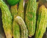 A picture of step 1 of Khatta Meetha Karela (Bitter Gourd and Raw Mango Chutney).
