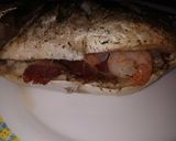 Foto del paso 3 de la receta: Dorada al horno rellena de jamón y langostinos