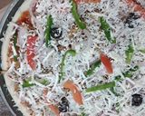 A picture of step 2 of Maxican pizza.