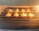 A picture of step 4 of Parmesan chilli duchess potatoes swirl with red pepper sauce.