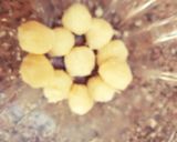 A picture of step 2 of Easy No Bake Coconut Candy Balls.