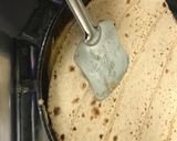 A picture of step 6 of Omelette-roti sandwich.