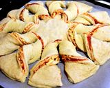 A picture of step 9 of Twisted pizza with tomato and cheese filling.