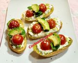 A picture of step 6 of Toasts with Cottage Cheese, Cherry Tomatoes, Guacamole, and More.