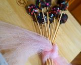 A picture of step 6 of 1 bite chocolatey marshmallow pops.