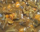A picture of step 7 of Curried Goat with Parsley Pea Rice.