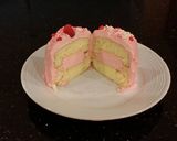 A picture of step 20 of Vanilla Butter Cakes filled and Frosted with Whipped White Chocolate Rasberry Ganache.
