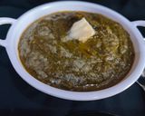A picture of step 7 of Sarson ka Saag with Makki di Roti.