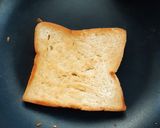 A picture of step 2 of Beans on scrambled egg on toast.