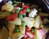 A picture of step 1 of Carrot, Potato, Cauliflower, and Pea Vegetable Curry.