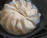 A picture of step 7 of Japanese pan fried dumplings with pork, napa cabbage and spring onion 🥟 - Gyoza.