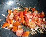 A picture of step 2 of Baingan and Aloo fry.