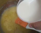 A picture of step 2 of Eggless mawa cup cake topping with shrikhand.