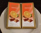 A picture of step 6 of Orange Milk Chocolate and White Chocolate Mousse Torte.