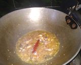A picture of step 2 of Cauliflower curry with white gravy.