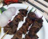 A picture of step 8 of Seekh kabab on gas stove.
