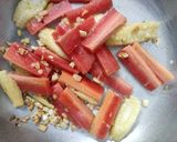 A picture of step 3 of Tomato Soup with sauteed garlic vegetables.