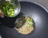 A picture of step 2 of Split Jowar Vegetable. Khichdi.