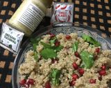 A picture of step 3 of Quinoa, spinach and pomegranate salad with italian dressing.