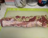 A picture of step 5 of Rolled Pork belly stuffed with Sage and onion stuffing.