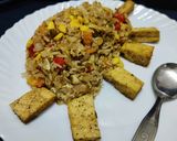 A picture of step 9 of Thai style fried rice with vegetables and tofu.