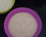 A picture of step 5 of Eggless mawa cup cake topping with shrikhand.