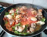 A picture of step 5 of Chicken and Pork Rib Paella.
