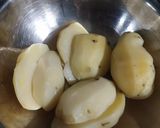 A picture of step 7 of Chole ragda with potato pattice.
