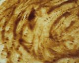 A picture of step 5 of Malai boti pizza with white sauce.