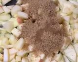 A picture of step 2 of Apple pie with flaky butter crust served with vanilla ice cream.