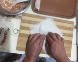 A picture of step 4 of Cheat Day Crispy pork spring rolls.