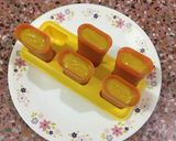 A picture of step 8 of Mango Popsicles.