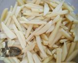 A picture of step 2 of Thelay walay french fries with illaichi wali chai.