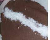 A picture of step 4 of Coconut swiss roll.