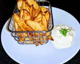 A picture of step 7 of Spicy potato wedges.