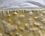 Foto del paso 4 de la receta: Lacitos de hojaldre con crema de chocolate y piñones