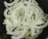A picture of step 3 of Miso soup with tofu, daikon, onion.