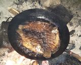 A picture of step 5 of Kachumbari with fish and greens.