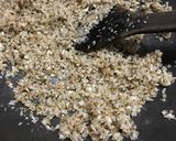 A picture of step 1 of Gurer Narkel Naru (coconut ladoo).