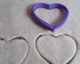 A picture of step 3 of Heart shaped mandazi.