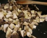 A picture of step 2 of Funghi Gratinati mushrooms with breadcrumbs.